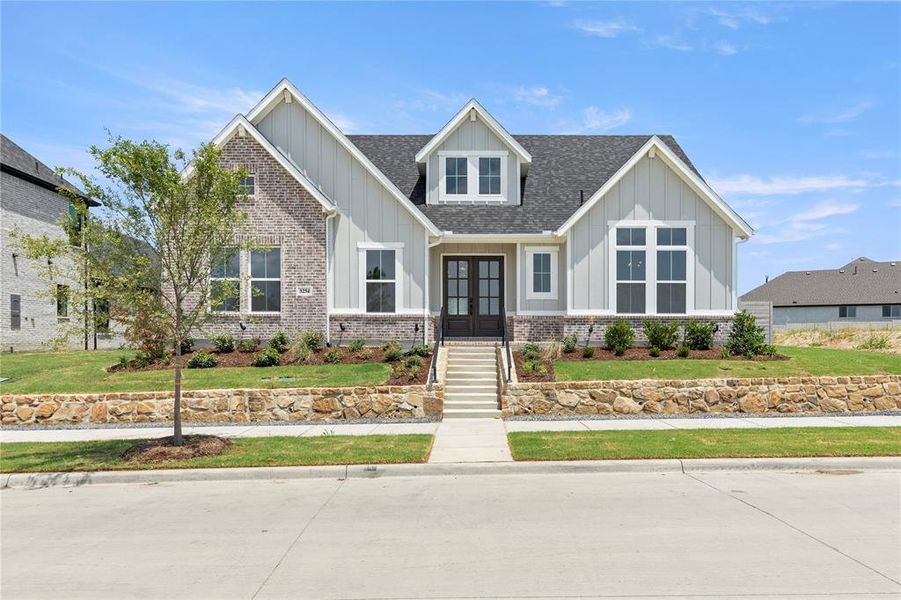 Front exterior of a new home in Painted Tree Showcase, McKinney, TX, highlighting curb appeal (Image 17).