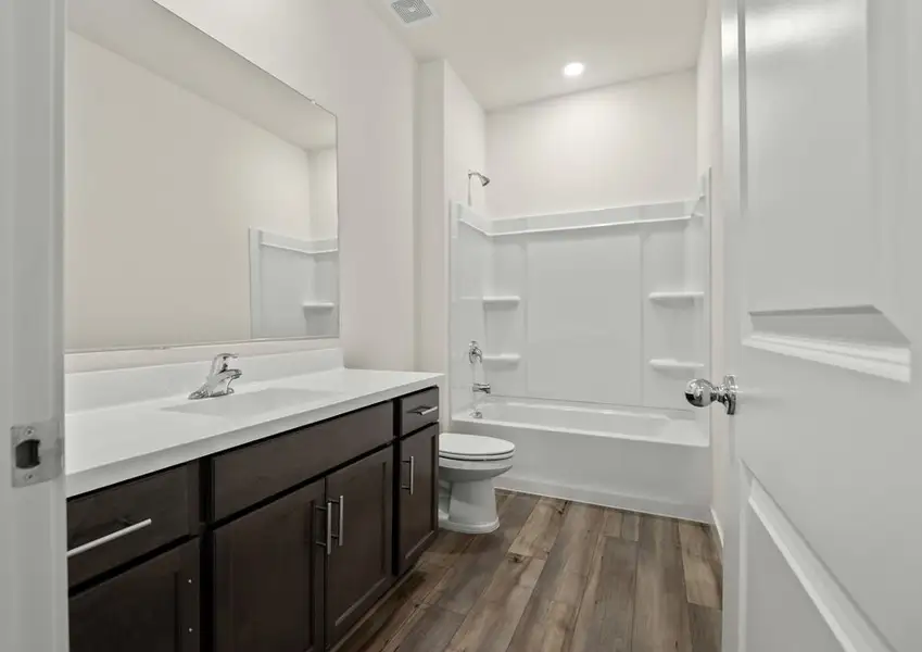 The secondary bathroom has plenty of space for getting ready.
