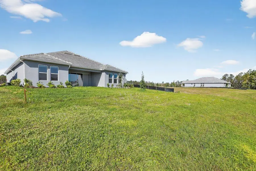 Exterior details and patio area of a home in Hammock at Two Rivers, Zephyrhills (Image 25).