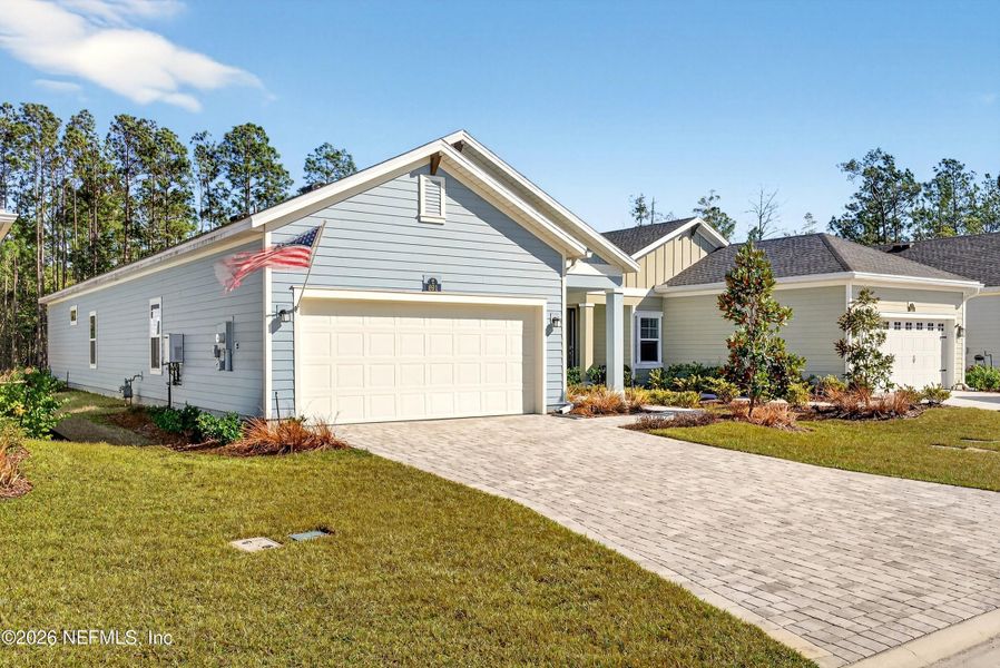 Front exterior of a new home in , St. Johns, FL, highlighting curb appeal (Image 2). Front exterior of a new home in , St. Johns, FL, highlighting curb appeal (Image 2).