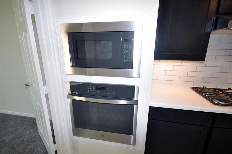 Built in Self Cleaning ovens nd microwave above.