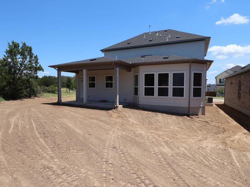 Front exterior of a new home in Edgewood, Leander, TX, highlighting curb appeal (Image 1). Front exterior of a new home in Edgewood, Leander, TX, highlighting curb appeal (Image 1).