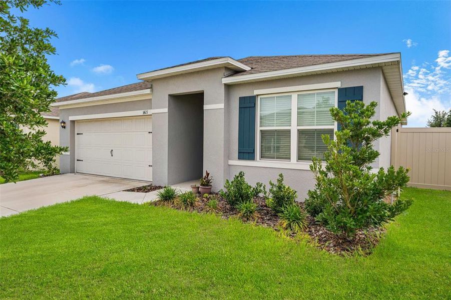 Front exterior of a new home in Cascades, Davenport, FL, highlighting curb appeal (Image 21). Front exterior of a new home in Cascades, Davenport, FL, highlighting curb appeal (Image 21).