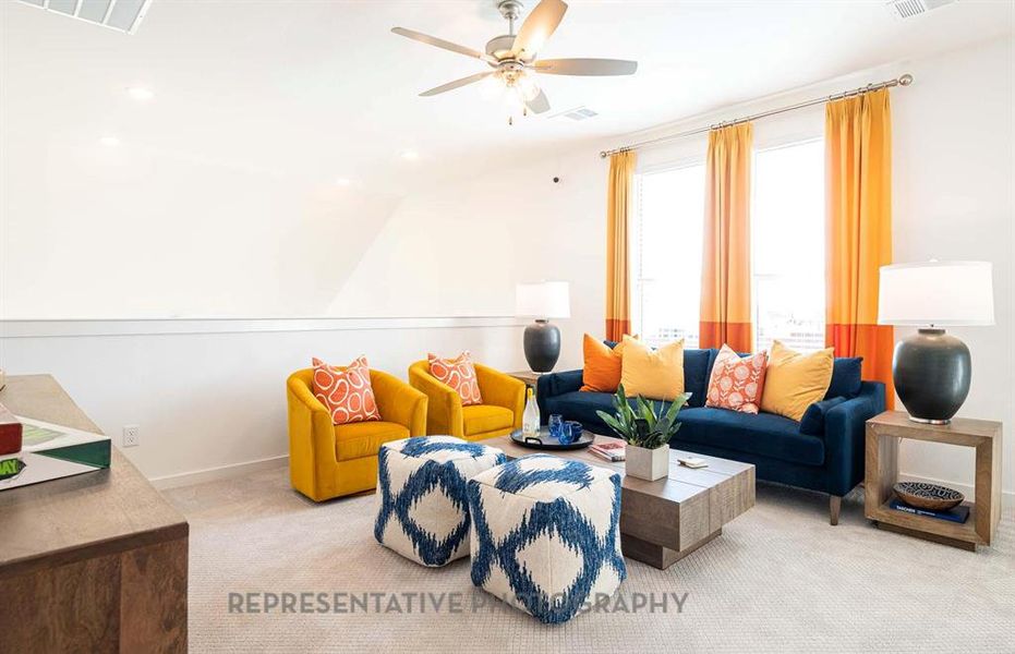 Living area featuring carpet flooring, a ceiling fan, lofted ceiling, and recessed lighting