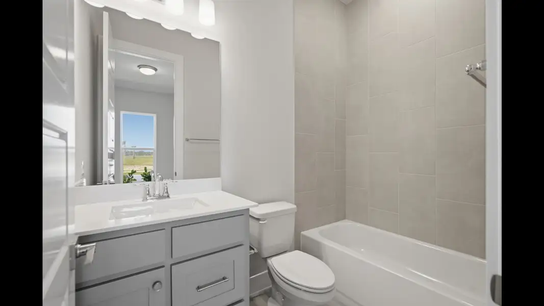 Representative furnished interior of a home built from the 2546F by Perry Homes in Sanctuary at Seaire, Parrish (Image 13).