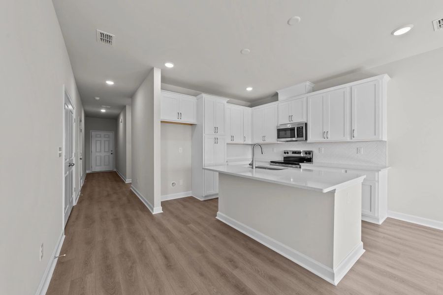 Furnished interior view inside a new home in Blue Heron Retreat: Villas, Little River (Image 9).