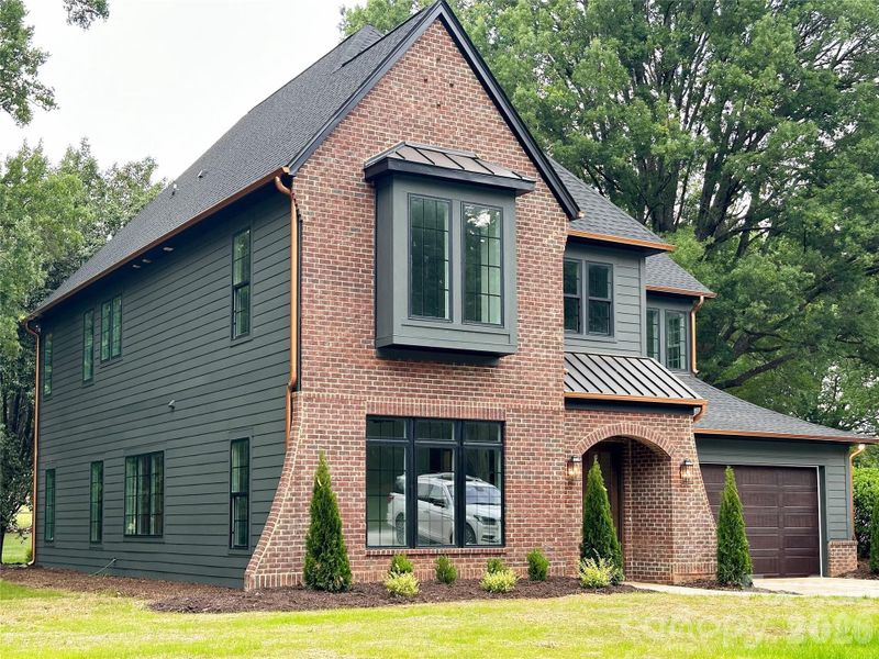 Front exterior of a new home in , Matthews, NC, highlighting curb appeal (Image 25).