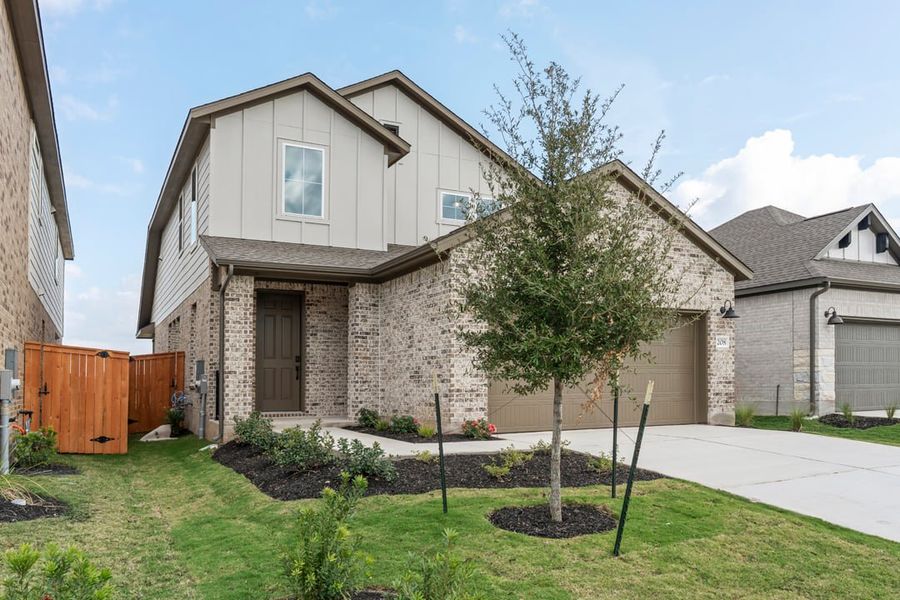 Front exterior of a new home in Terrace Collection at Lariat, Liberty Hill, TX, highlighting curb appeal (Image 26).