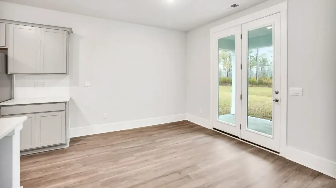 Representative unfurnished interior of a home built from the Claiborne by D.R. Horton in The Highlands at Cedar Hill Landing, Navassa (Image 13).