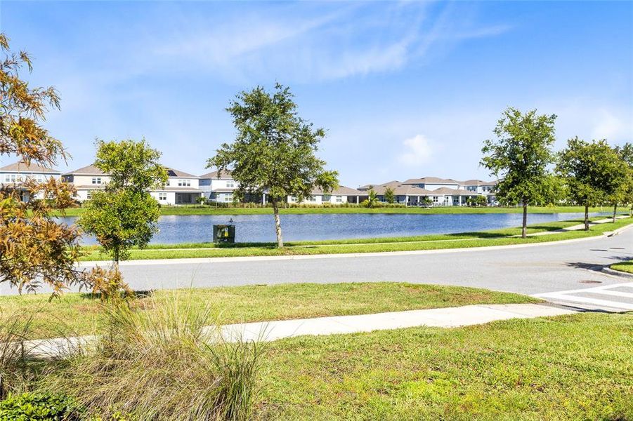 Front exterior of a new home in Isles of Lake Nona, Orlando, FL, highlighting curb appeal (Image 21). Front exterior of a new home in Isles of Lake Nona, Orlando, FL, highlighting curb appeal (Image 21).