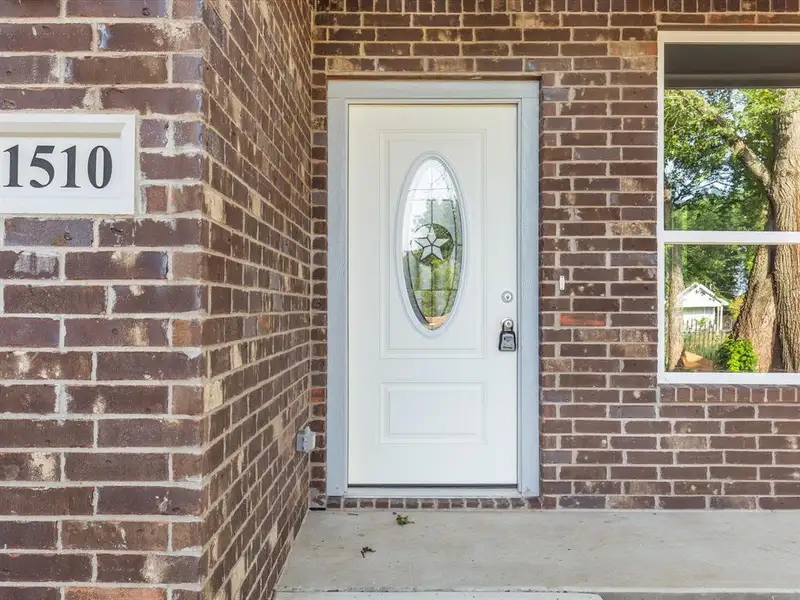 Entrance to property featuring brick siding Entrance to property featuring brick siding