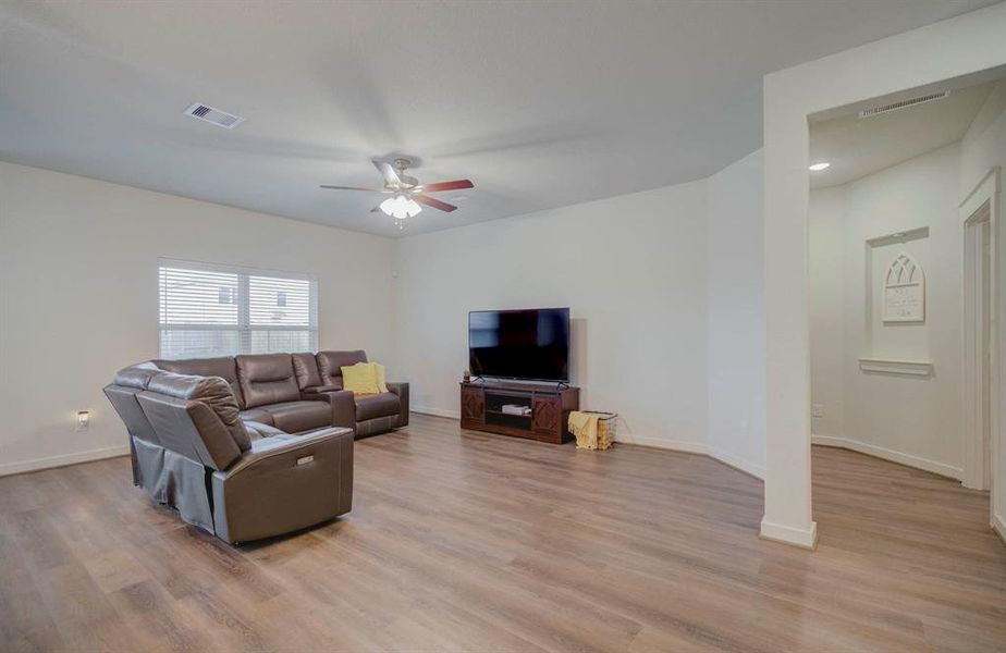 Living room with primary room and laundry room hallway to the left!