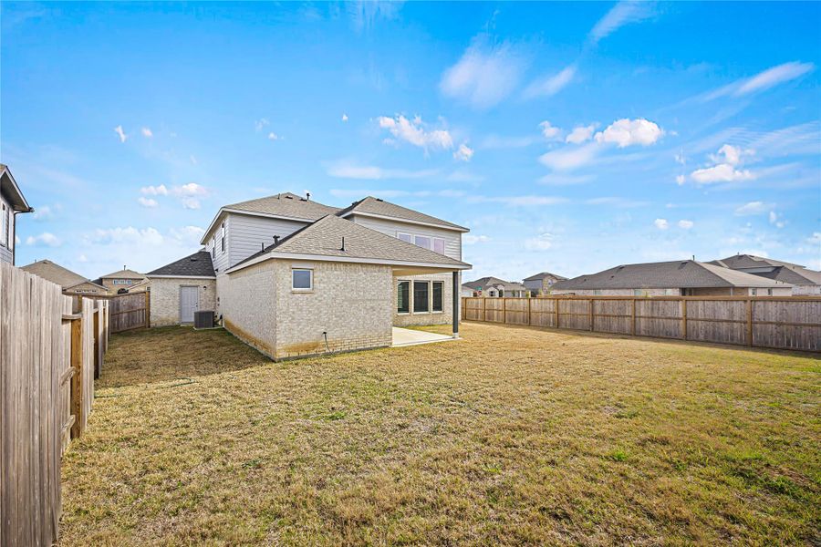 Exterior details and patio area of a home in River Ranch Meadows, Dayton (Image 21). Exterior details and patio area of a home in River Ranch Meadows, Dayton (Image 21).