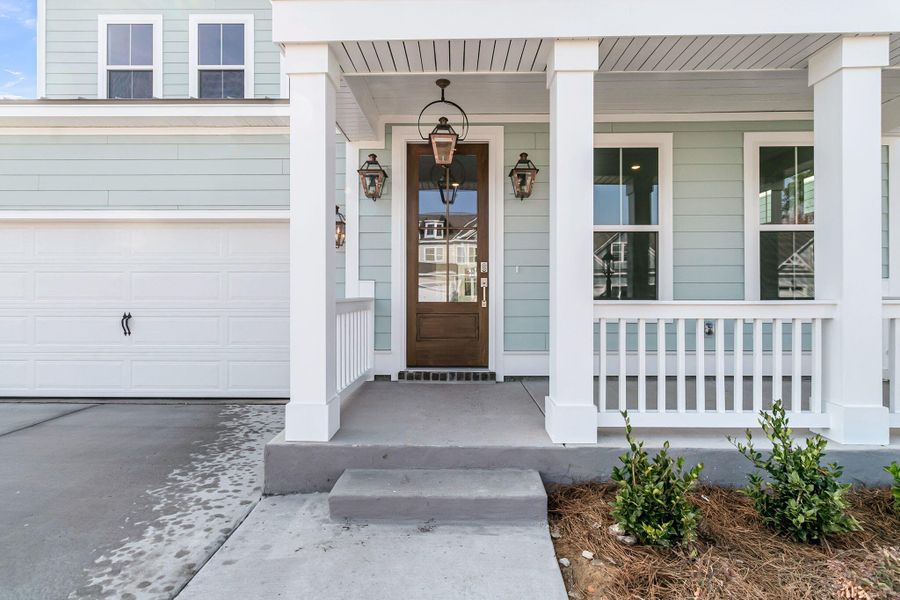 Exterior details and patio area of a home in Tidewater at Lakes of Cane Bay, Summerville (Image 2). Exterior details and patio area of a home in Tidewater at Lakes of Cane Bay, Summerville (Image 2).