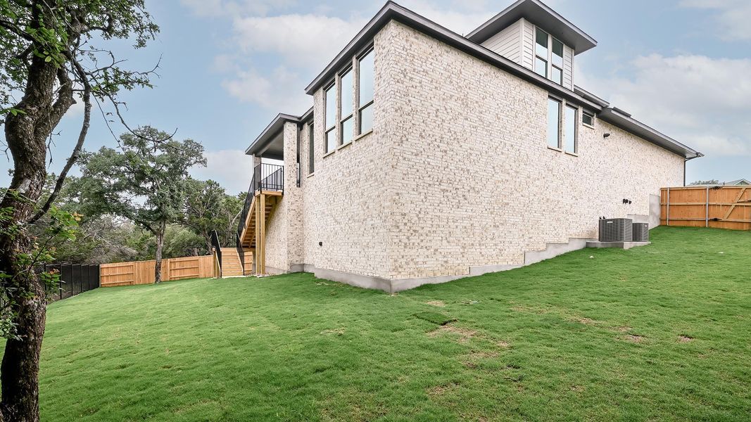 Exterior details and patio area of a home in 6 Creeks, Kyle (Image 4).