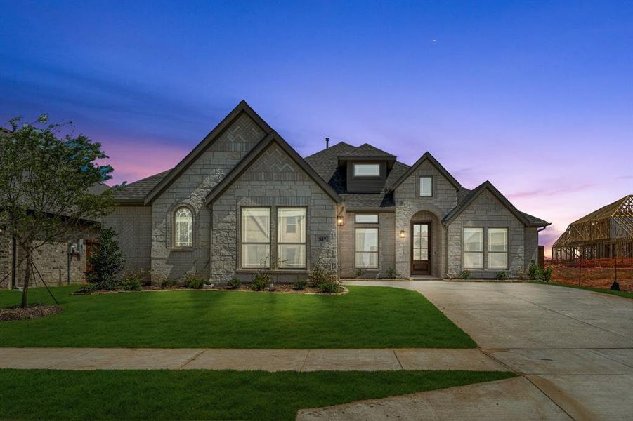 Front exterior of a new home in Wildflower Ranch 60-65, Justin, TX, highlighting curb appeal (Image 22). Front exterior of a new home in Wildflower Ranch 60-65, Justin, TX, highlighting curb appeal (Image 22).
