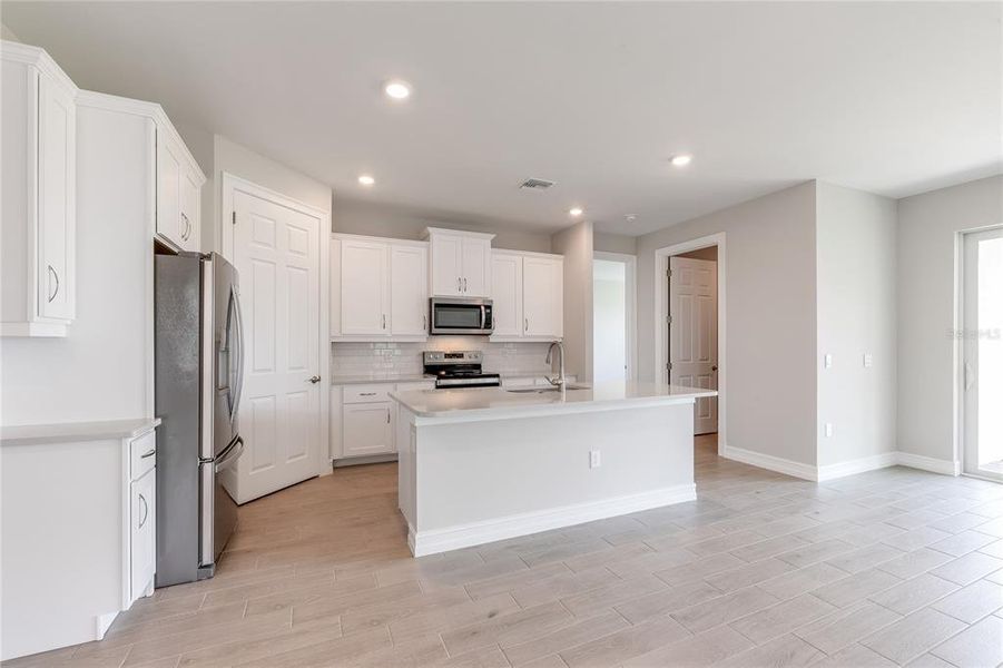Furnished interior view inside a new home in Coral Lakes - Tradition & Express, Punta Gorda (Image 6).