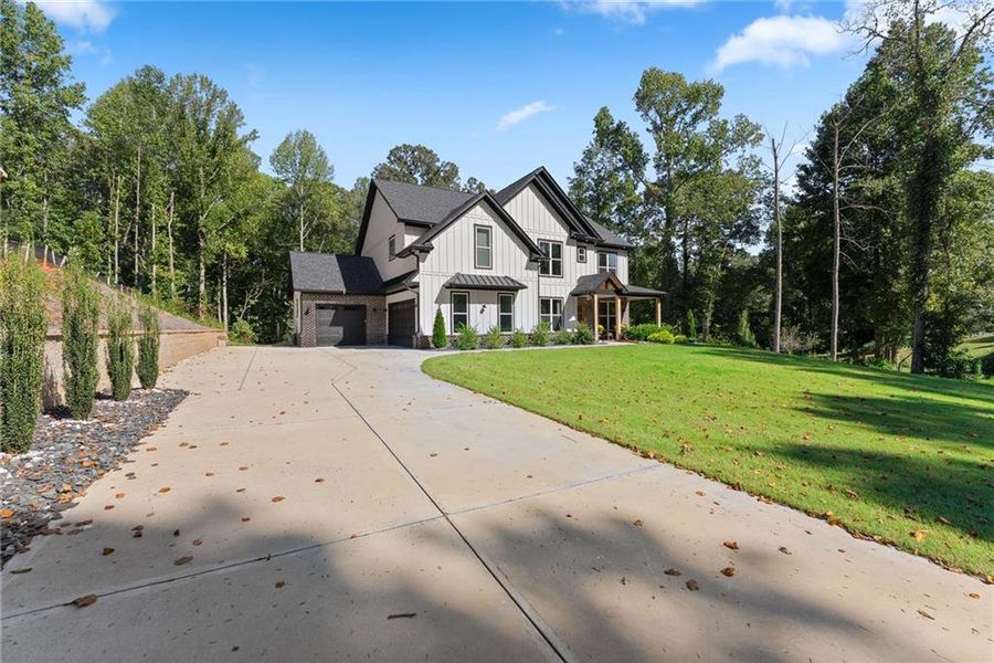 Front exterior of a new home in , Hoschton, GA, highlighting curb appeal (Image 2). Front exterior of a new home in , Hoschton, GA, highlighting curb appeal (Image 2).