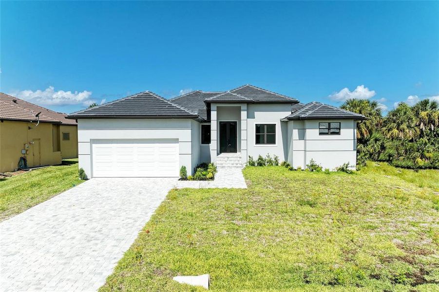 Front exterior of a new home in , Punta Gorda, FL, highlighting curb appeal (Image 26). Front exterior of a new home in , Punta Gorda, FL, highlighting curb appeal (Image 26).