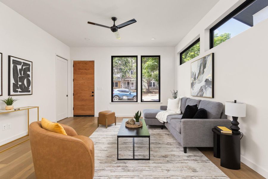Hardwood floors and an open concept create a seamless flow from entry to living area.