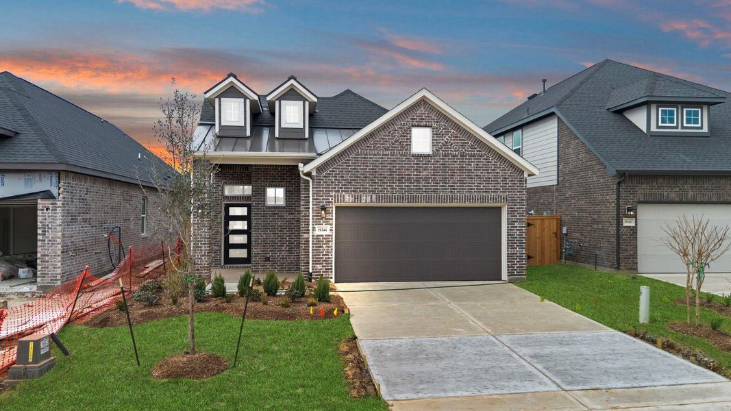 Front exterior of a new home in Emory Glen, Magnolia, TX, highlighting curb appeal (Image 18). Front exterior of a new home in Emory Glen, Magnolia, TX, highlighting curb appeal (Image 18).