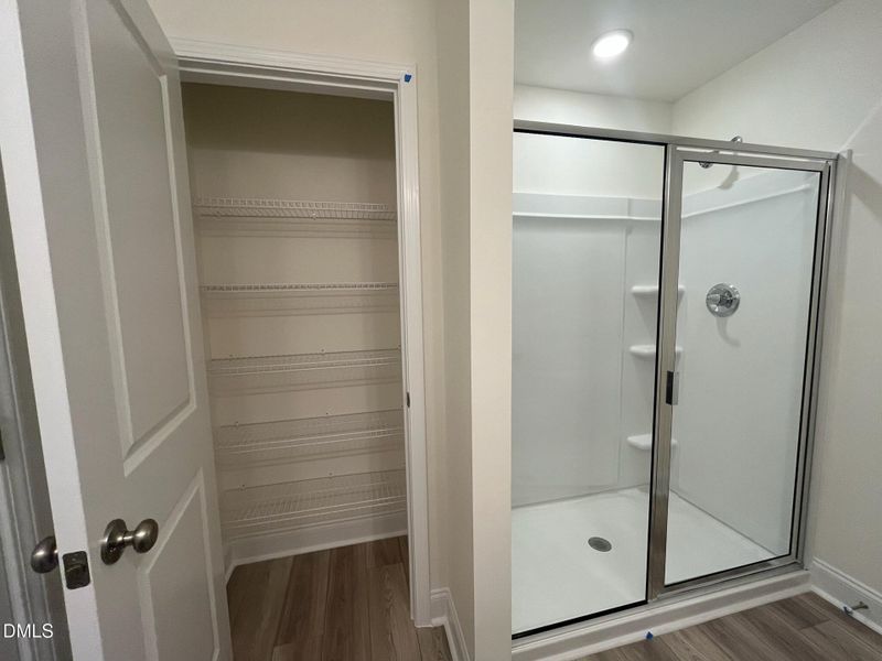 Primary shower with private linen closet