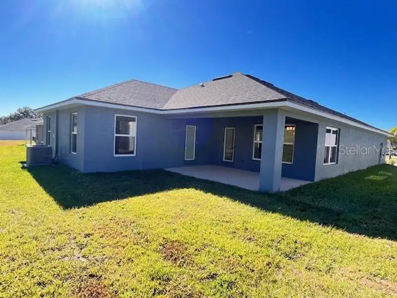 Exterior details and patio area of a home in Abbey Glen, Dade City (Image 2).