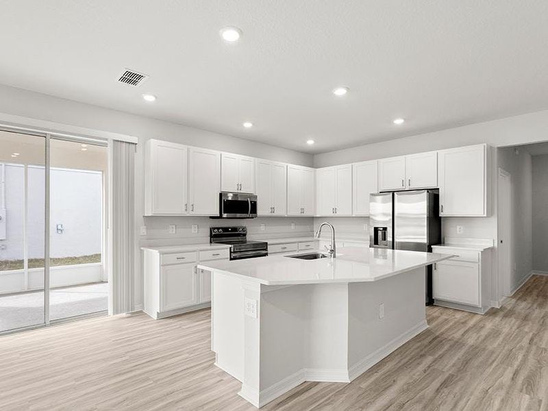 Your bright, open kitchen includes a large island, pantry, and beautiful finishes - Danyella bungalow by Highland Homes