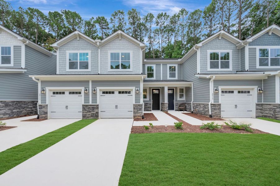 Front exterior of a new home in Ashmore Townes, Garner, NC, highlighting curb appeal (Image 18). Front exterior of a new home in Ashmore Townes, Garner, NC, highlighting curb appeal (Image 18).