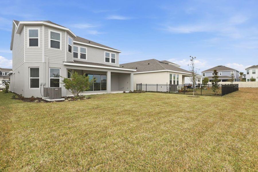 Exterior details and patio area of a home in Indigo Creek, Apollo Beach (Image 3).