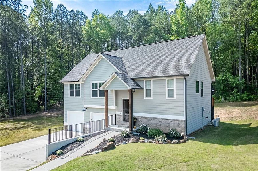 Front exterior of a new home in , Villa Rica, GA, highlighting curb appeal (Image 1). Front exterior of a new home in , Villa Rica, GA, highlighting curb appeal (Image 1).