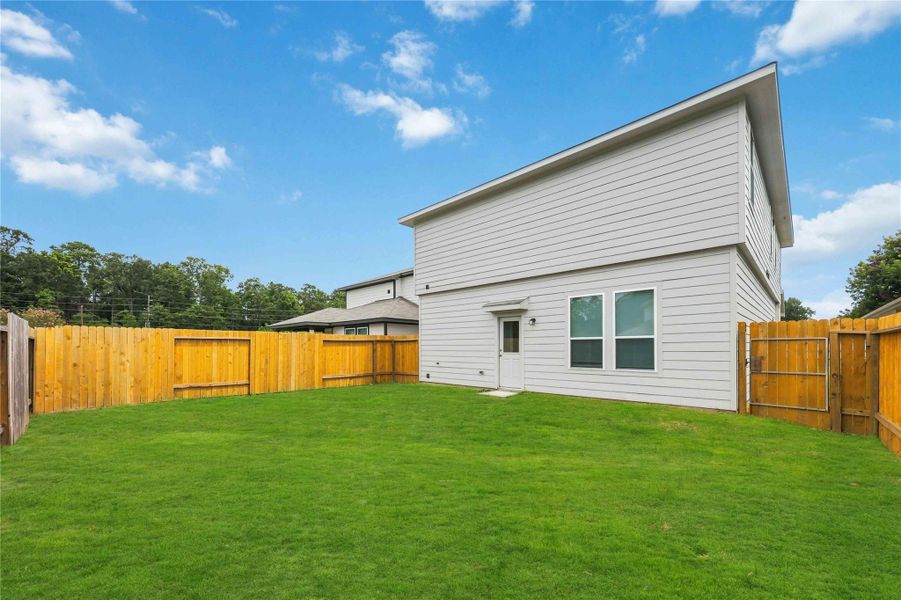 Exterior details and patio area of a home in , New Caney (Image 22).