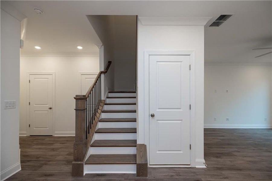 View from kitchen, stairs lead upstairs to the second floor, you will also have a coat closet, powder room and storage closet on the main level. Fantastic floor plan. Pictures represent a previously built home not the actual home, home is under construct