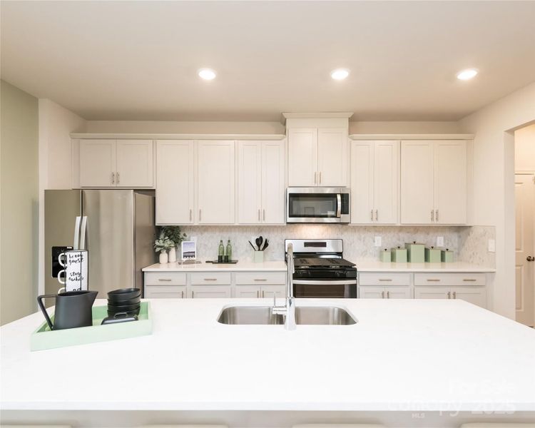 Photo is not of the actual home, but is an inspirational photo of builder’s model home and may depict options, furnishings, and/or decorator features that are not included