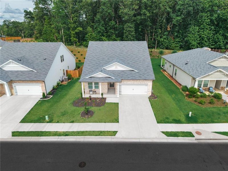 Front exterior of a new home in , Canton, GA, highlighting curb appeal (Image 27).