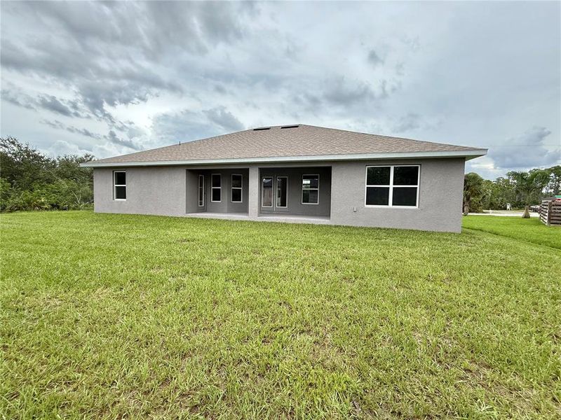 Front exterior of a new home in South Gulf Cove, Port Charlotte, FL, highlighting curb appeal (Image 16).