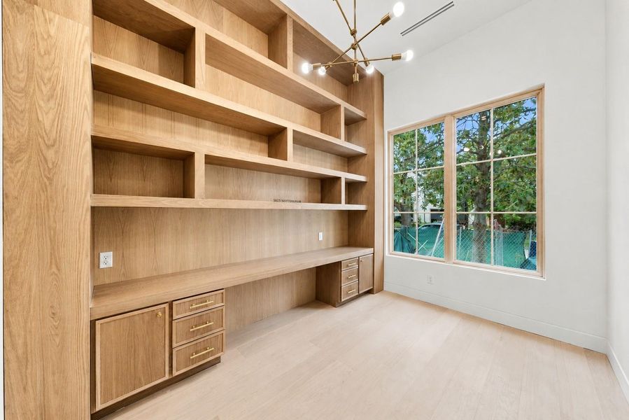 Custom office space showcases every detail has been carefully considered to create a homethat feels both sophisticated and comfortable, blending classicproportions with modern functionality for today's lifestyle.