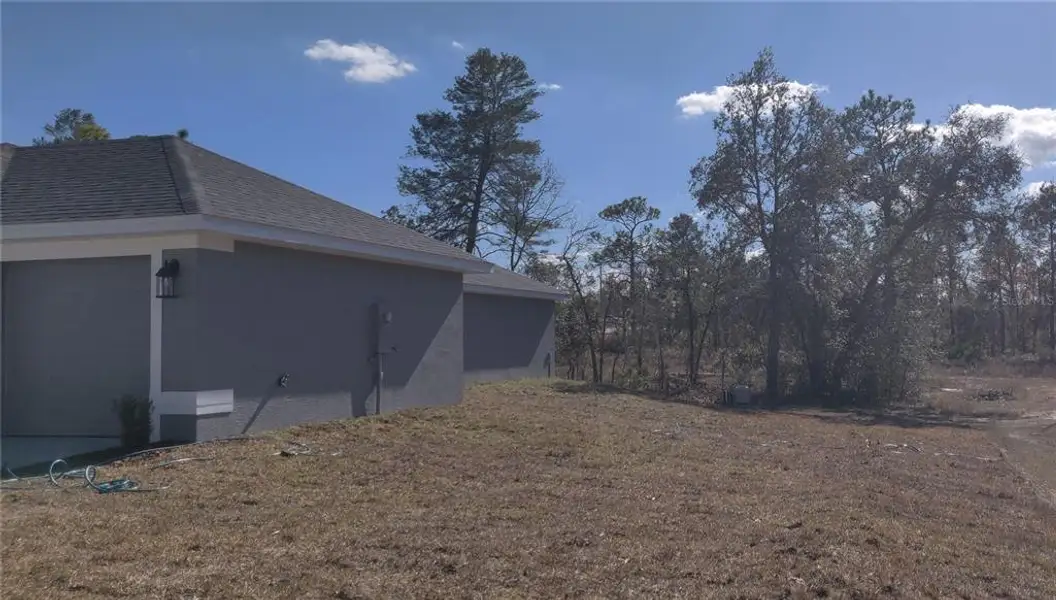 Exterior details and patio area of a home in Royal Highlands, Brooksville (Image 2). Exterior details and patio area of a home in Royal Highlands, Brooksville (Image 2).