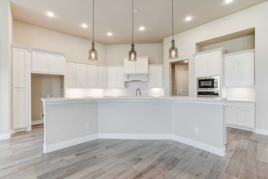 Representative furnished interior of a home built from the 2688 by Ravenna Homes in The Woodlands Hills 65′, Willis (Image 5).