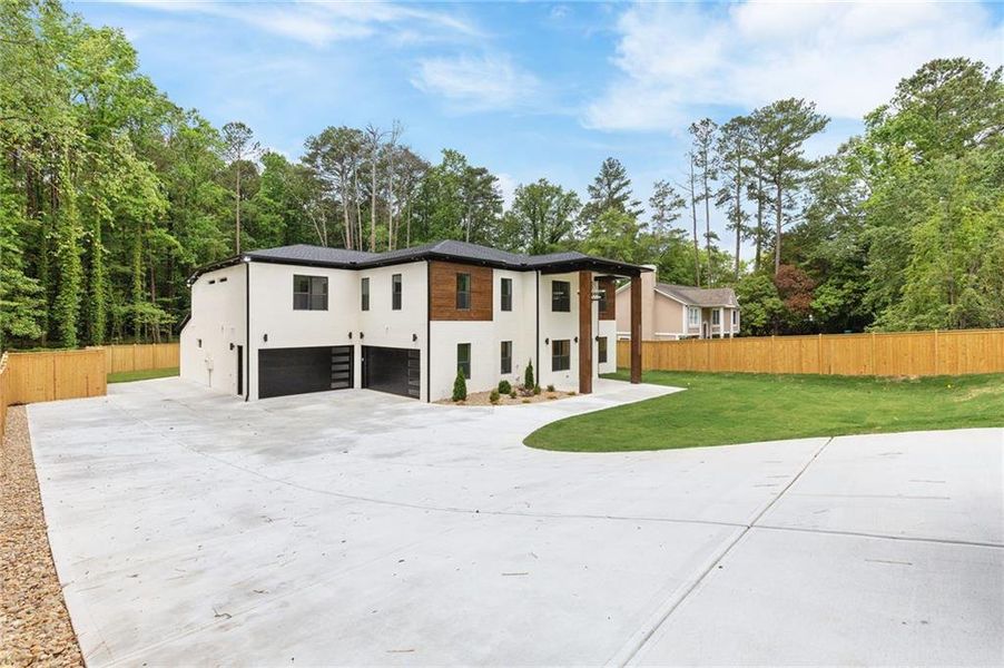 Front exterior of a new home in , Lilburn, GA, highlighting curb appeal (Image 35).