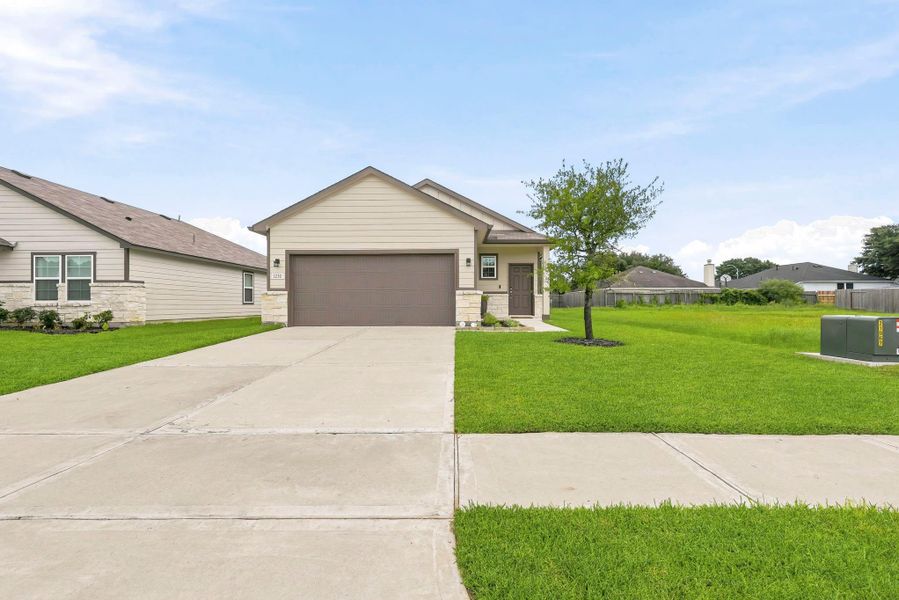 Front exterior of a new home in The Villages at Westpointe, Dayton, TX, highlighting curb appeal (Image 18).