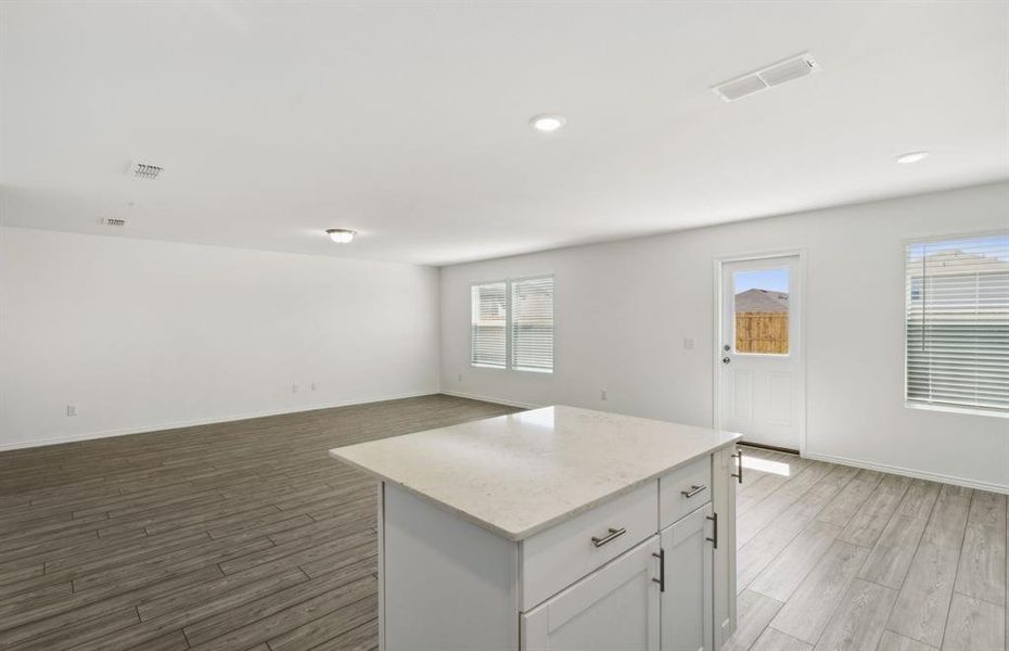 Oversized island in kitchen *real home pictured