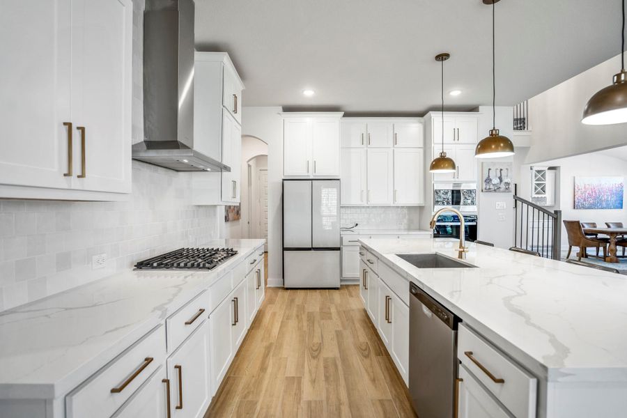 The space is brightened by natural light from large windows and enhanced by top-of-the-line finishes.