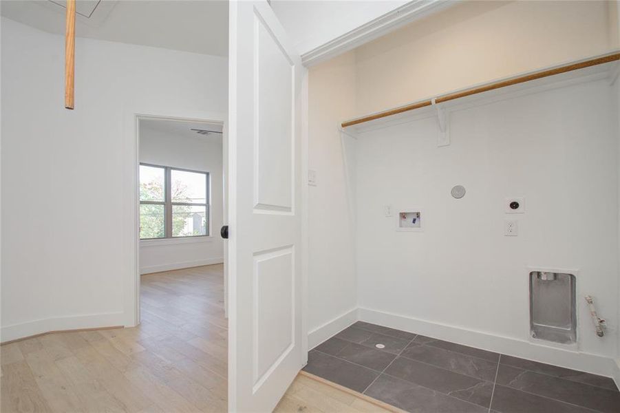 Utility room. Photos of similar completed home by same builder. Selections may differ.