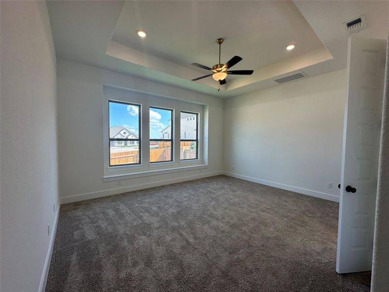 Primary Bedroom with tray ceiling
