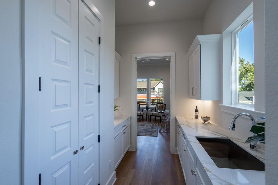 The elegant butler’s pantry offers additional prep space and a seamless flow between kitchen and dining. The elegant butler’s pantry offers additional prep space and a seamless flow between kitchen and dining.