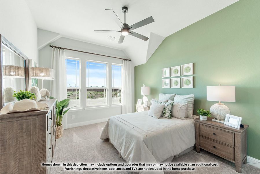 Bedroom with vaulted ceiling, ceiling fan, green accent wall, and large windows with natural light Bedroom with vaulted ceiling, ceiling fan, green accent wall, and large windows with natural light