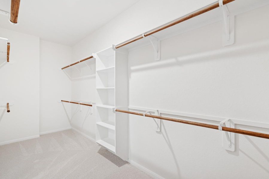 Large walk-in closet in the owner's suite (*Photo not of actual home and used for illustration purposes only.)