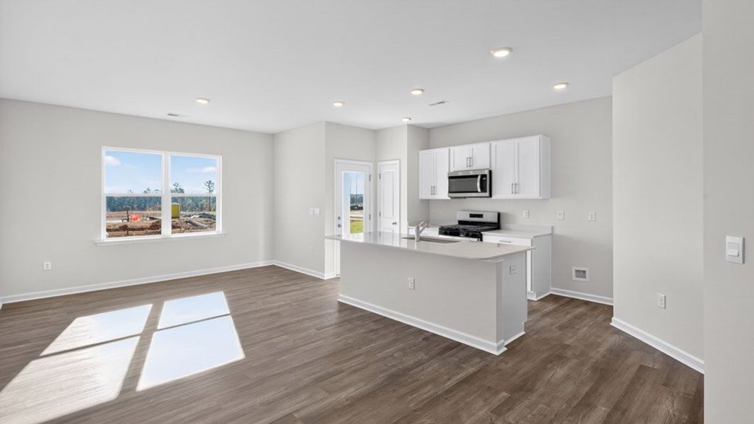 Representative furnished interior of a home built from the MAYWOOD by D.R. Horton in The Townes at Galvins Ridge, Sanford (Image 6).