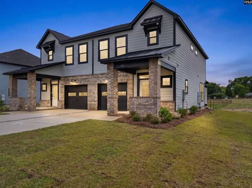 Front exterior of a new home in Dunbar Village, Cayce, SC, highlighting curb appeal (Image 21).